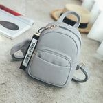 Mini Backpack with Fuzzy Ball Pendant